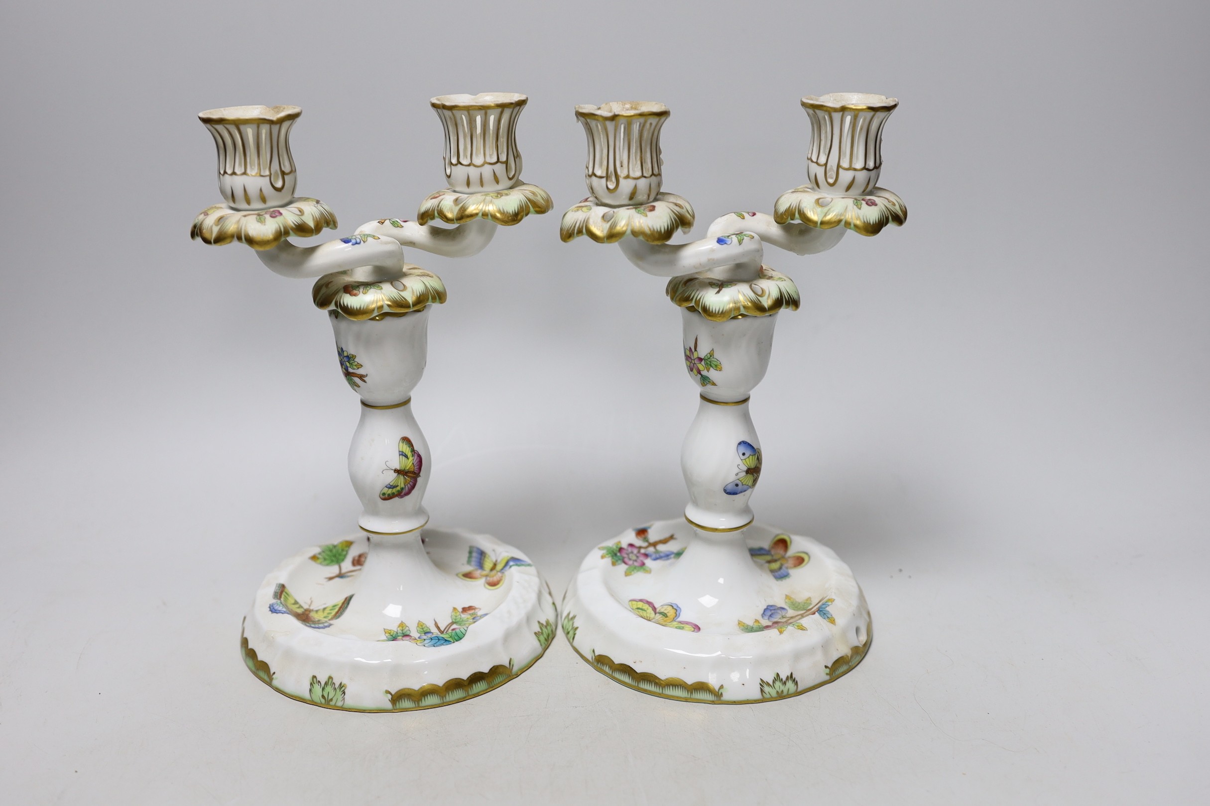 A pair of Herend porcelain two branch candelabra, 22cm